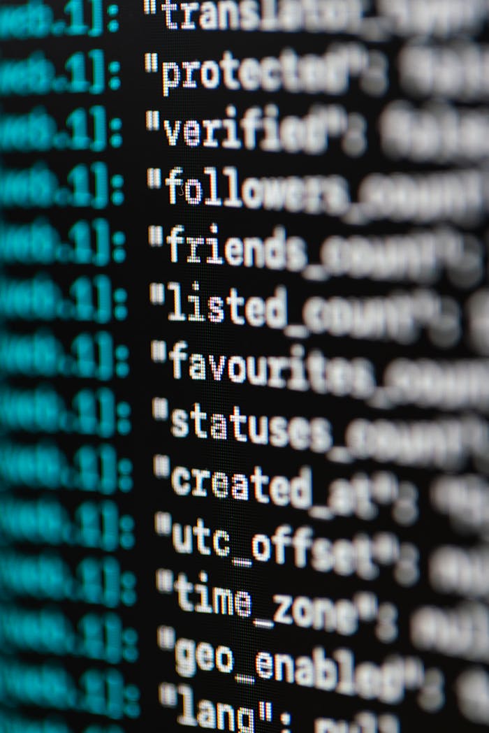 Services Extreme close-up of computer code displaying various programming terms and elements.